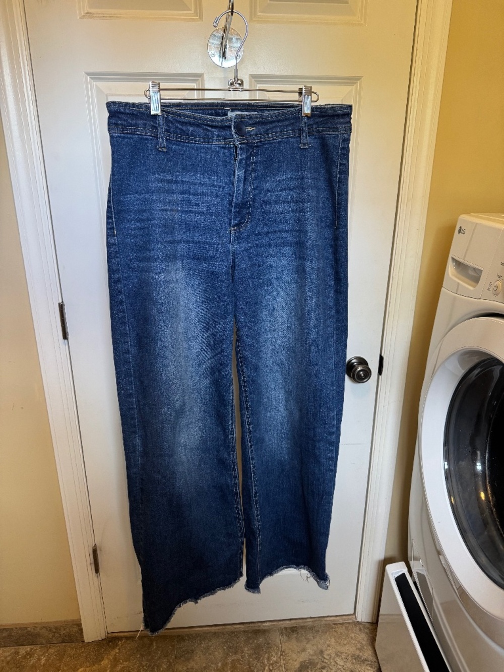 Oak medium blue wide-legged jeans size 30R. Raw edged hem